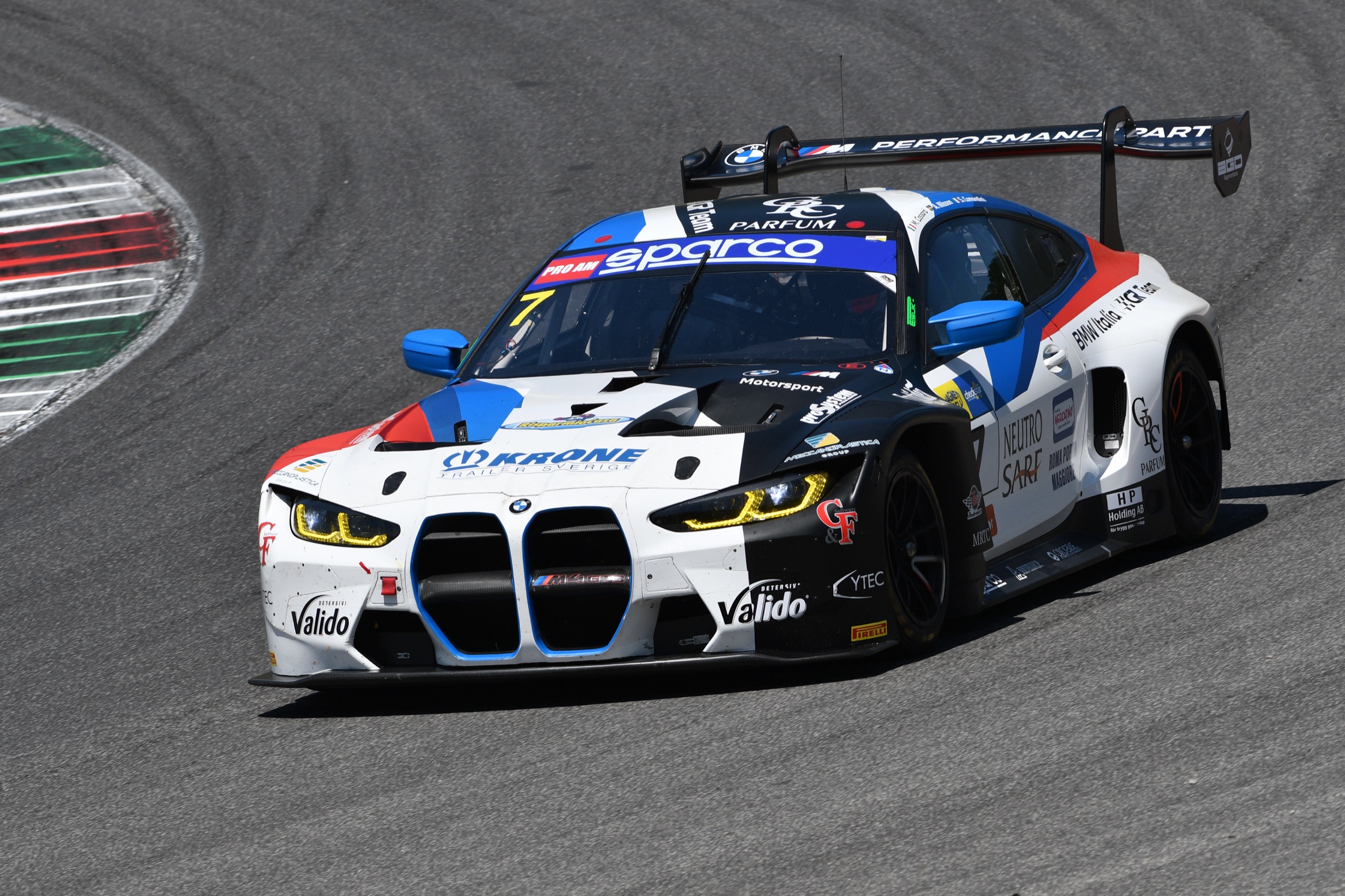 A GT race car cornering on a circuit