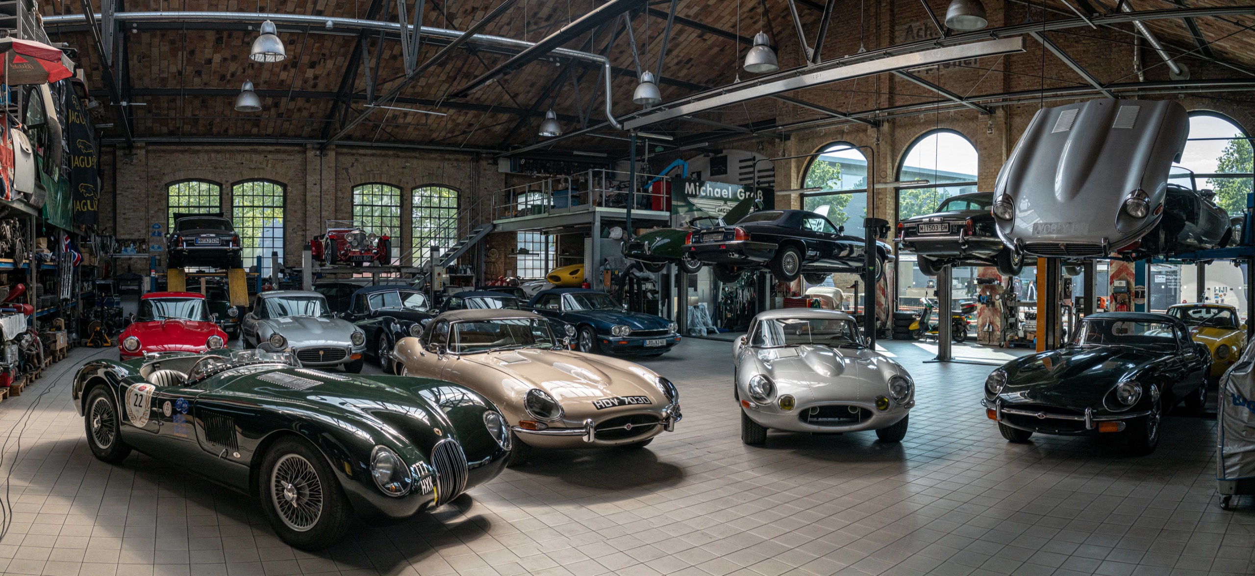 A collection of cars gathered in a clubhouse